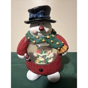 Ceramic Snow Man With A Globe. Festive And Looks Like It's Hand Made. 7'm Tall